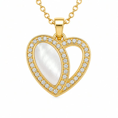 Dije de corazon con centro de nacar y contorno en pave