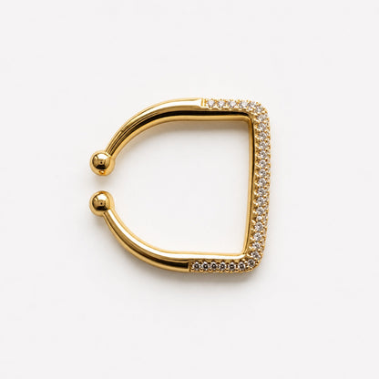 Anillo abierto dorado con el frente cuadrado en pavé de circonias y bolitas en las puntas