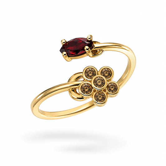 Anillo dorado ajustable con una flor de circonias y una piedra roja alargada
