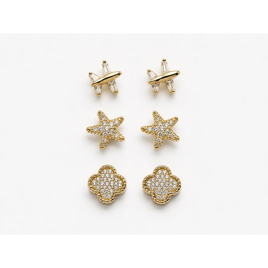 Set de tres pares de aretes dorados en pavé con forma de avión, estrella y trébol