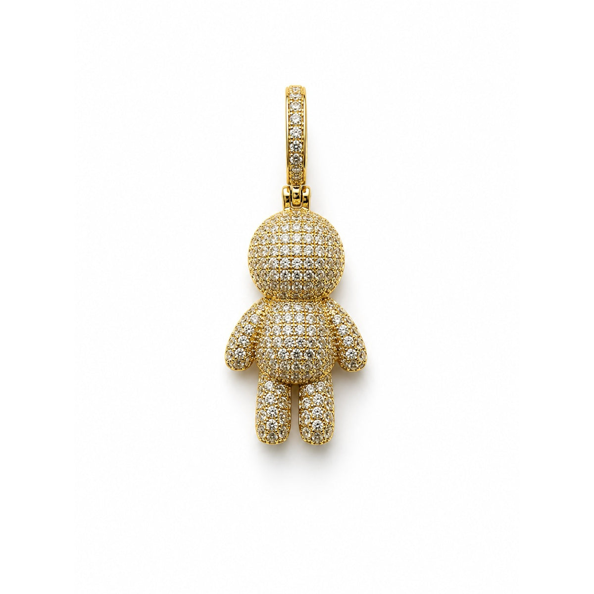 Dije dorado con figura de niño cubierta en pavé de circonias