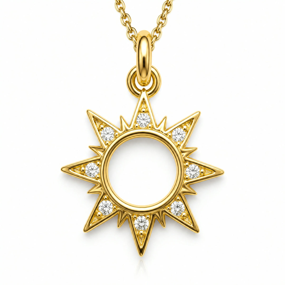 Dije dorado de sol con rayos y contorno en pave