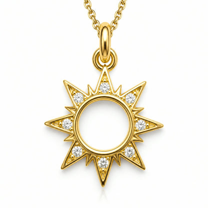 Dije dorado de sol con rayos y contorno en pave