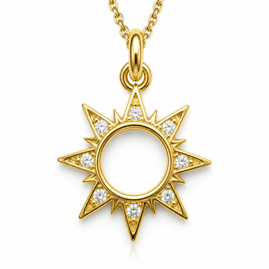 Dije dorado de sol con rayos y contorno en pave